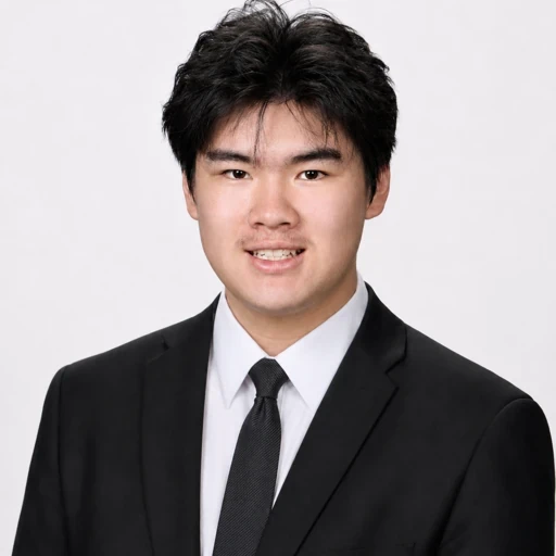 Howard Wang in a dark suit and tie