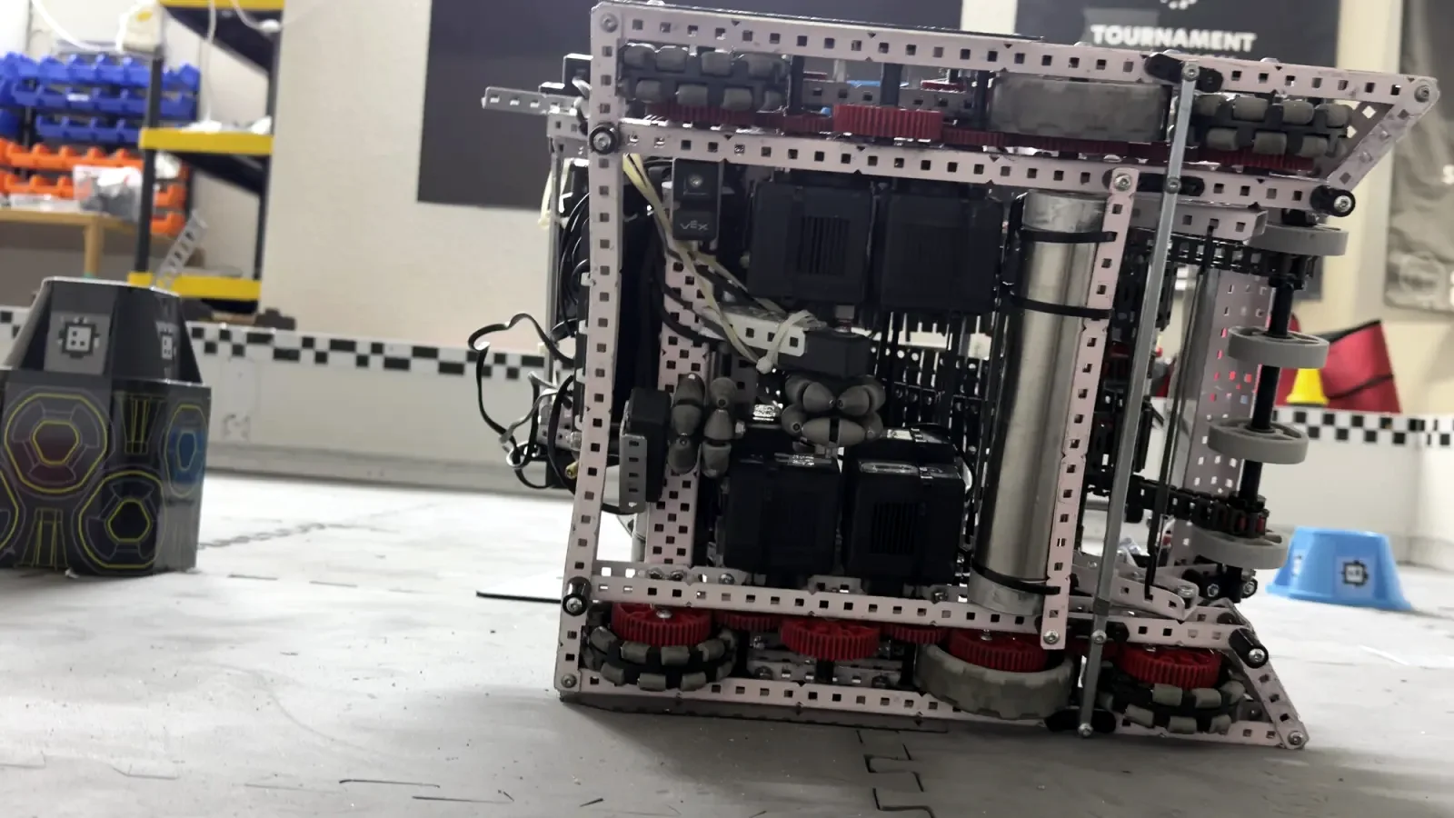 The robot on a competition field at a tournament, seen from the side at floor level