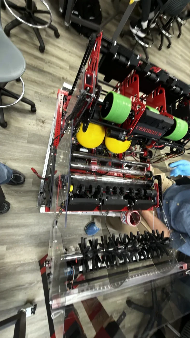 Overhead view of the Cerberus intake, with green and yellow rollers on a red frame