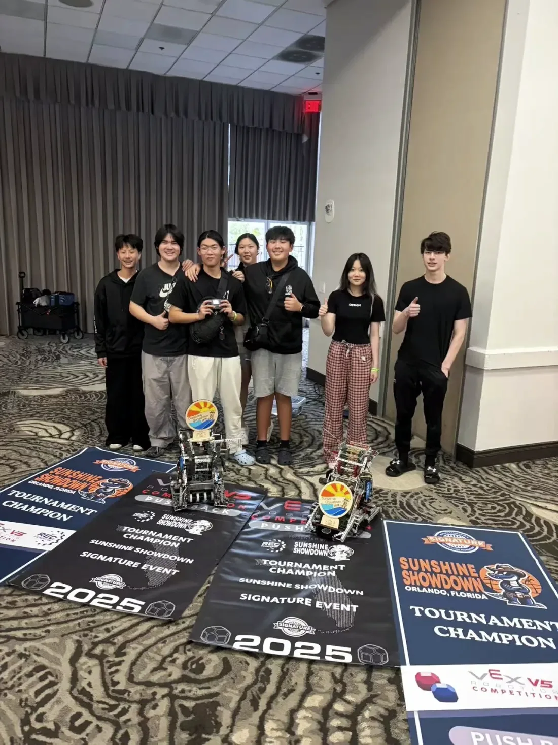 Team 1658S with their robots and Tournament Champion banners at the Sunshine Showdown Signature Event, Orlando, 2025
