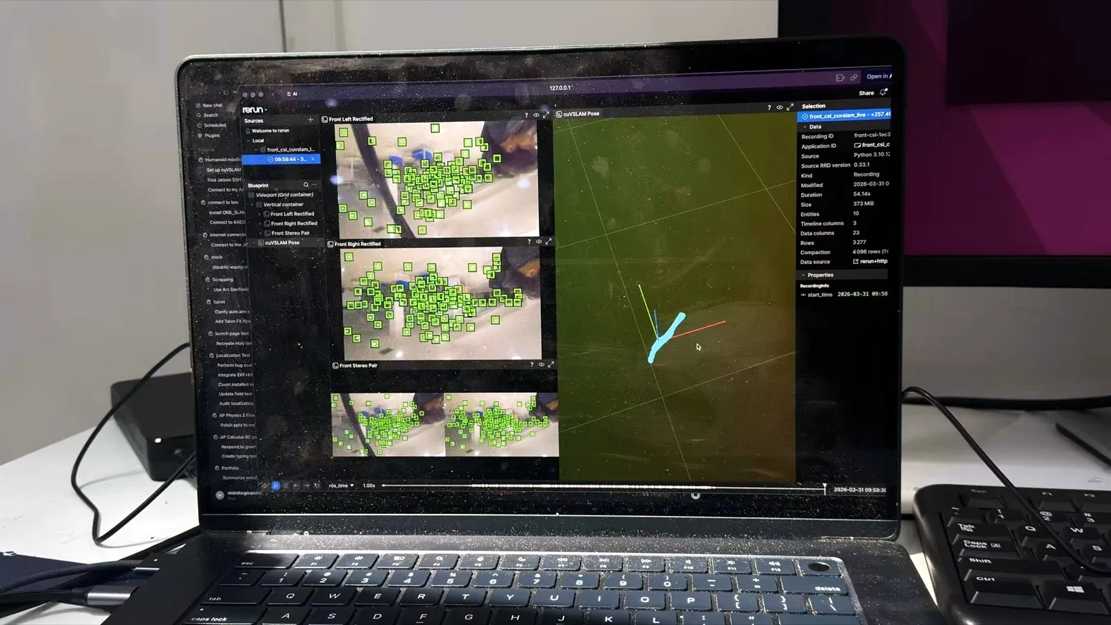 A laptop running live cuVSLAM stereo tracking, with feature matches on the left and the camera trajectory in Rerun on the right